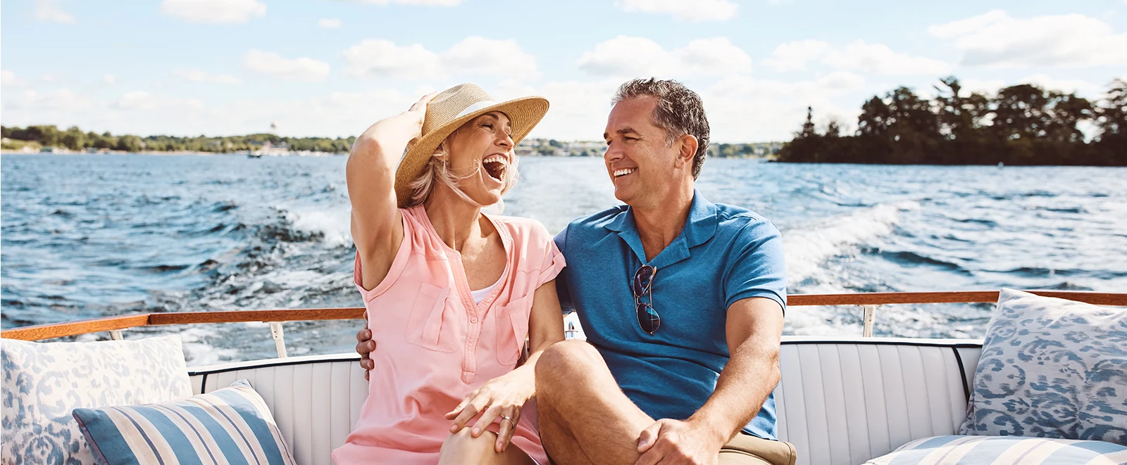 joyful mature couple on a boat