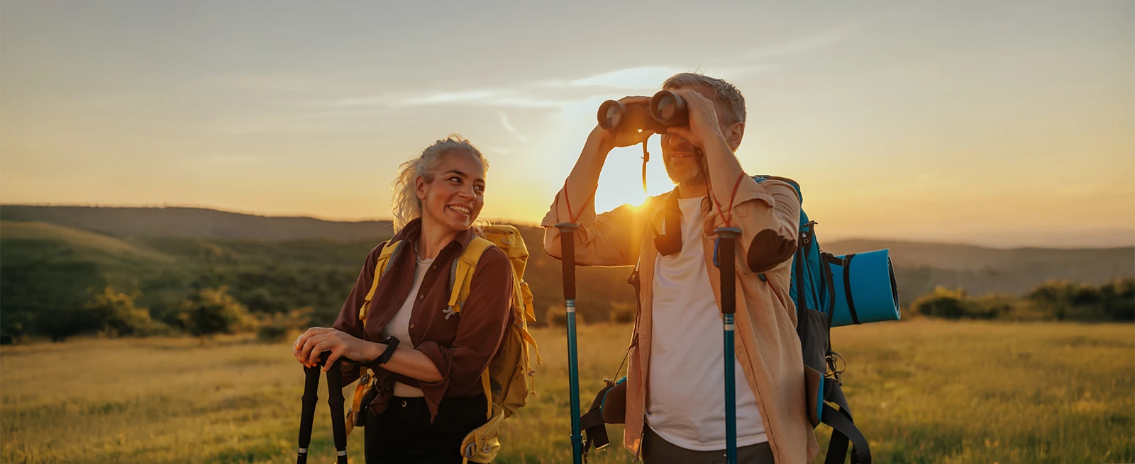middle aged hiking couple enjoying scenic view